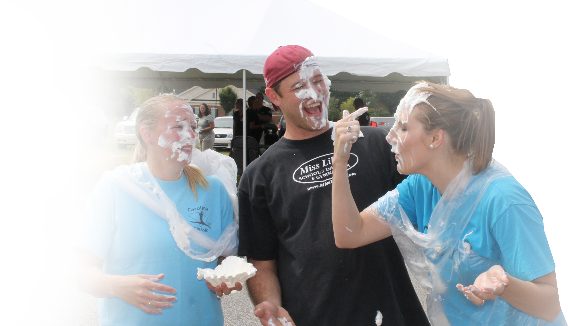 Miss Libby's staff laughing during a pie-in-the-face fundraiser