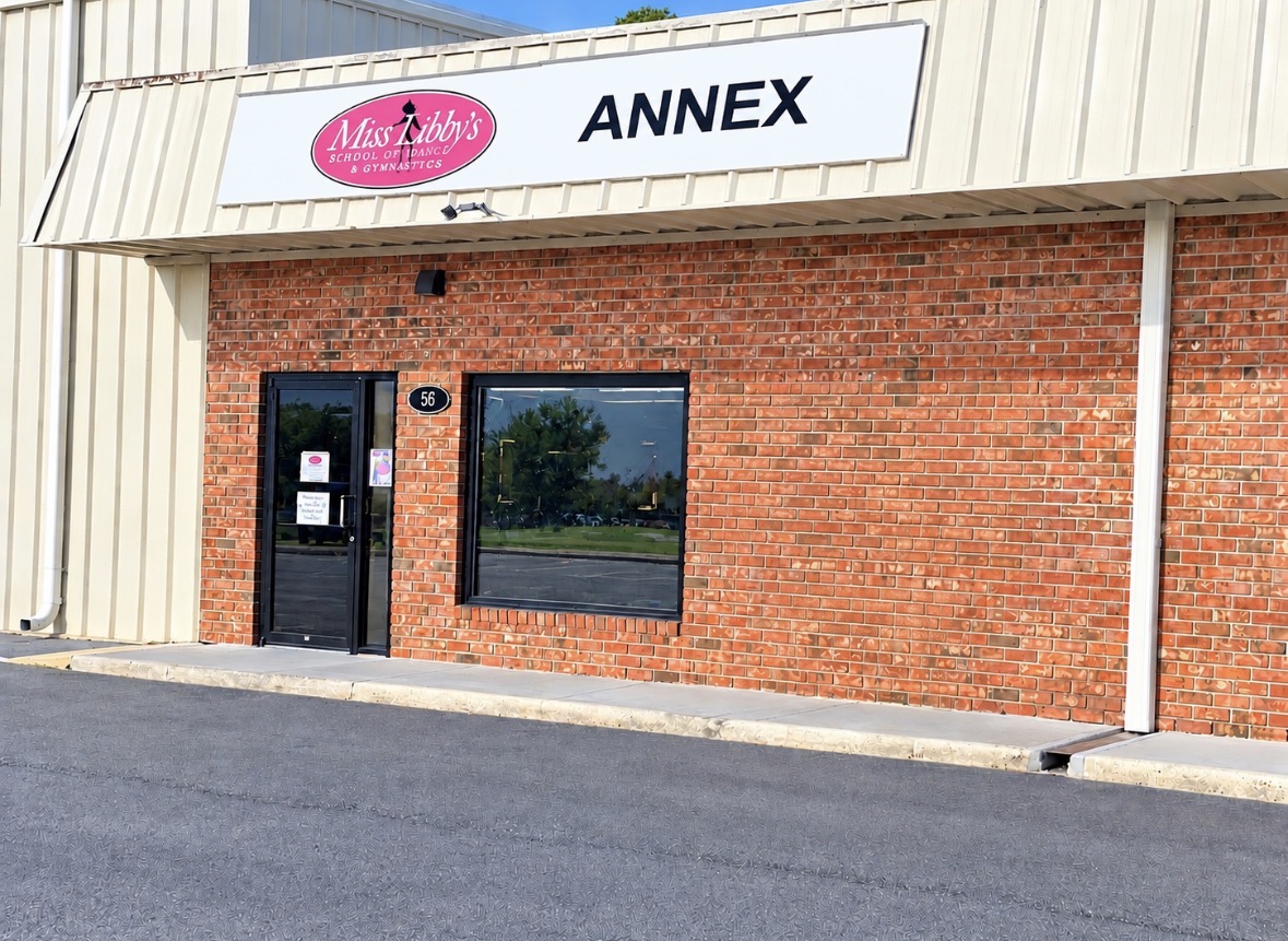 Angled view of the Miss Libby's Annex entrance with the address plaque number 56
